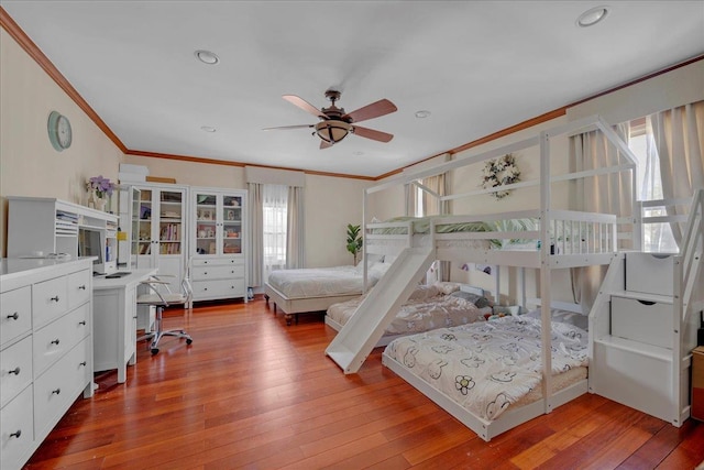 bedroom with ceiling fan, recessed lighting, light wood-style flooring, and crown molding