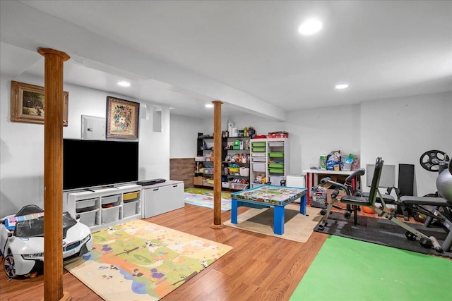 rec room with light wood-type flooring and recessed lighting