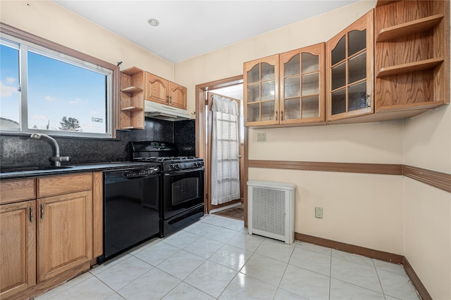 kitchen featuring open shelves, a sink, radiator, black appliances, and dark countertops