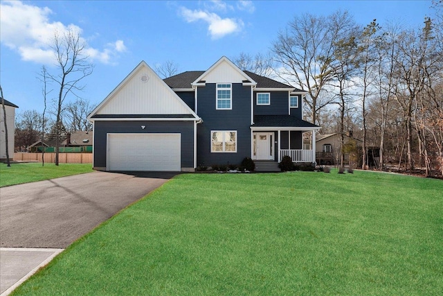 view of front of property featuring a garage, aphalt driveway, covered porch, fence, and a front lawn