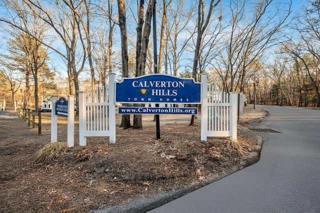 community sign featuring fence