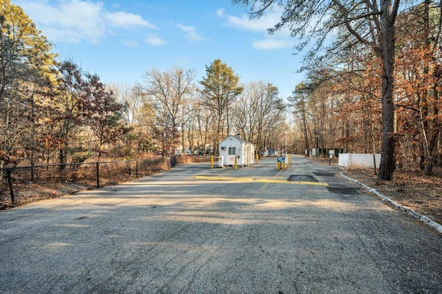 view of street with a gated entry