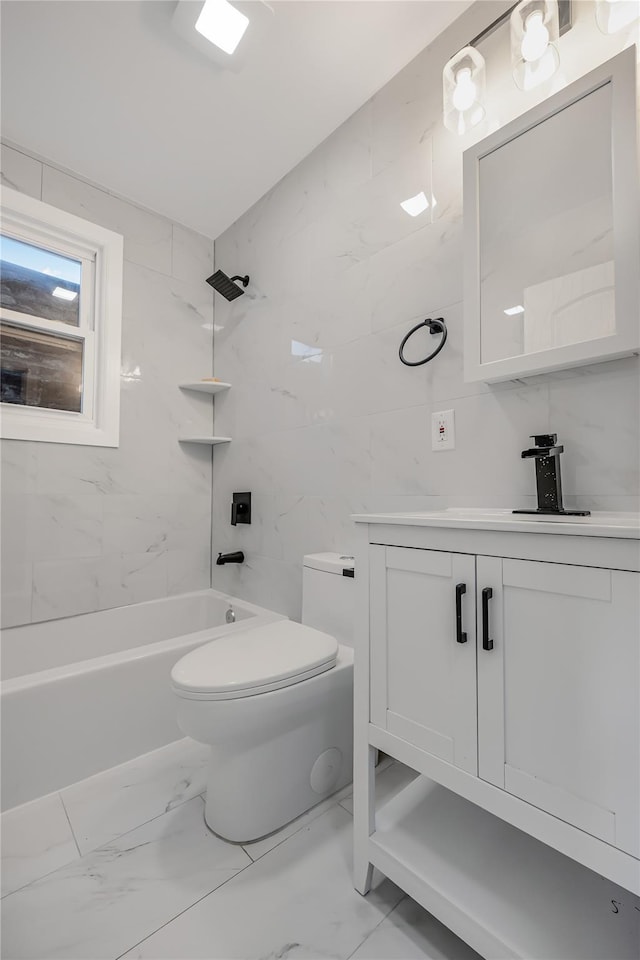 bathroom with toilet,  shower combination, marble finish floor, vanity, and tile walls