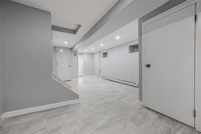 empty room featuring a baseboard radiator, marble finish floor, baseboards, and recessed lighting