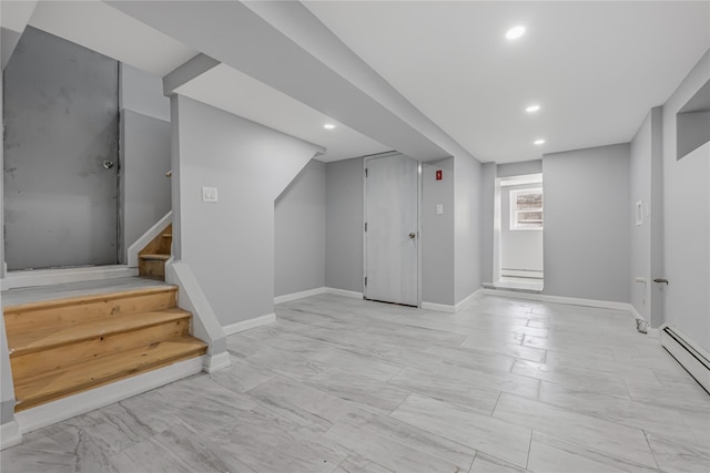 below grade area featuring a baseboard radiator, stairway, baseboards, and recessed lighting