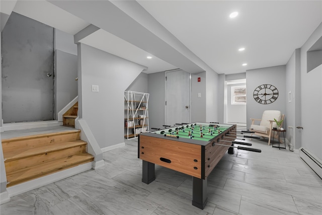 game room with a baseboard radiator, baseboards, and recessed lighting