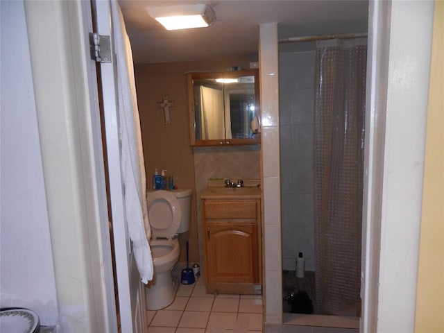 full bath with toilet, a stall shower, and tile patterned flooring