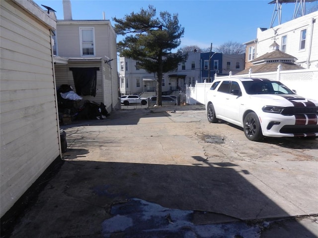 view of yard with a residential view and fence