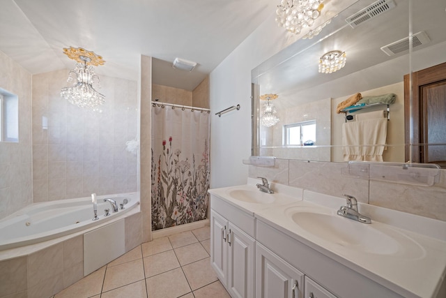 bathroom with a chandelier, visible vents, and a sink