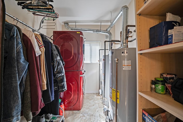 utility room featuring water heater and stacked washer and clothes dryer