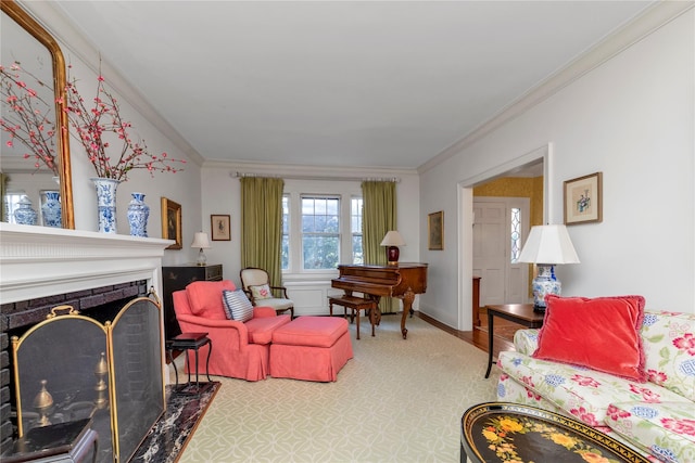 living area with crown molding, a fireplace, and baseboards