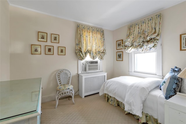 bedroom featuring cooling unit, carpet flooring, and radiator heating unit