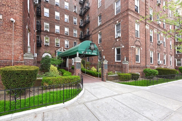 view of property featuring fence and cooling unit