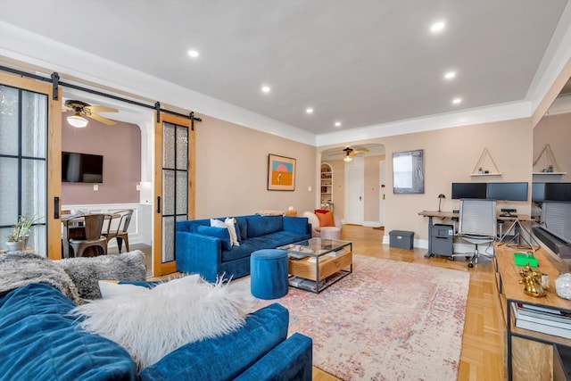 living room featuring crown molding, a barn door, a ceiling fan, and recessed lighting