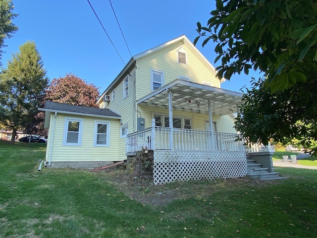 rear view of house featuring a yard and a pergola