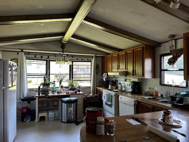 kitchen featuring vaulted ceiling with beams, under cabinet range hood, white appliances, dark countertops, and pendant lighting