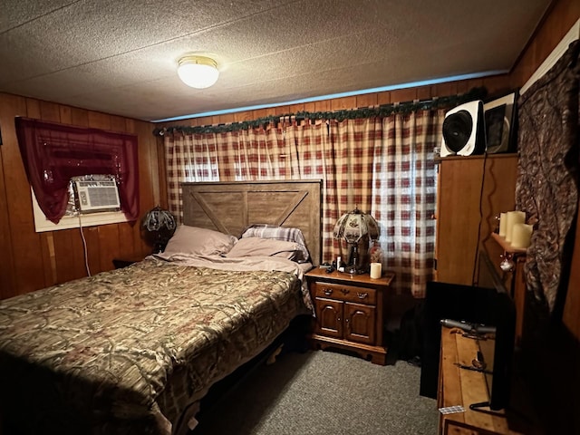 carpeted bedroom featuring a textured ceiling, cooling unit, and wooden walls