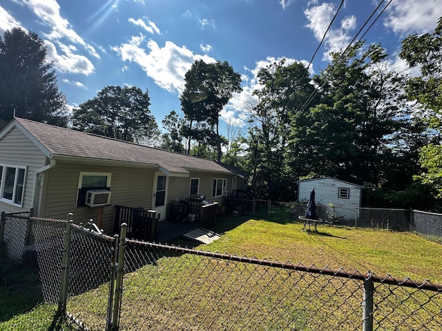 view of yard with a fenced backyard, cooling unit, and a wooden deck