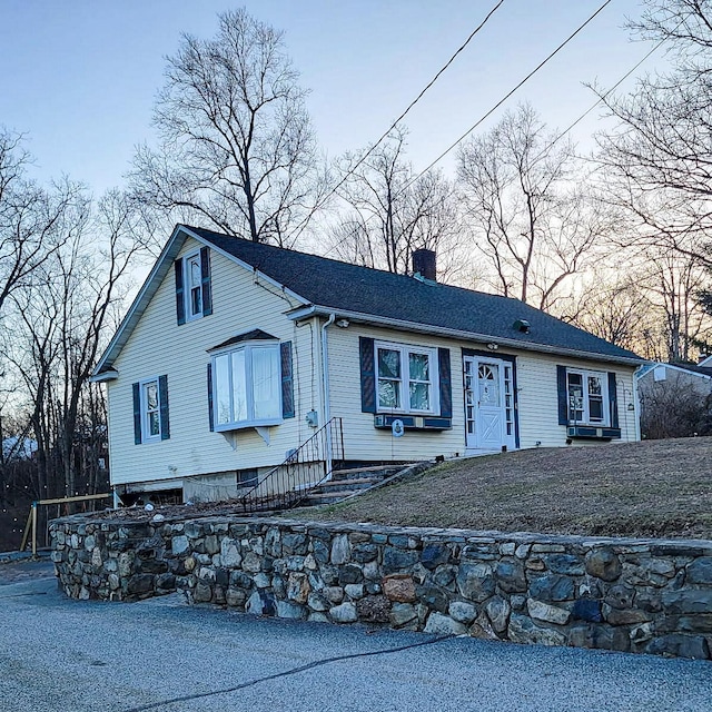 view of front of home with a chimney