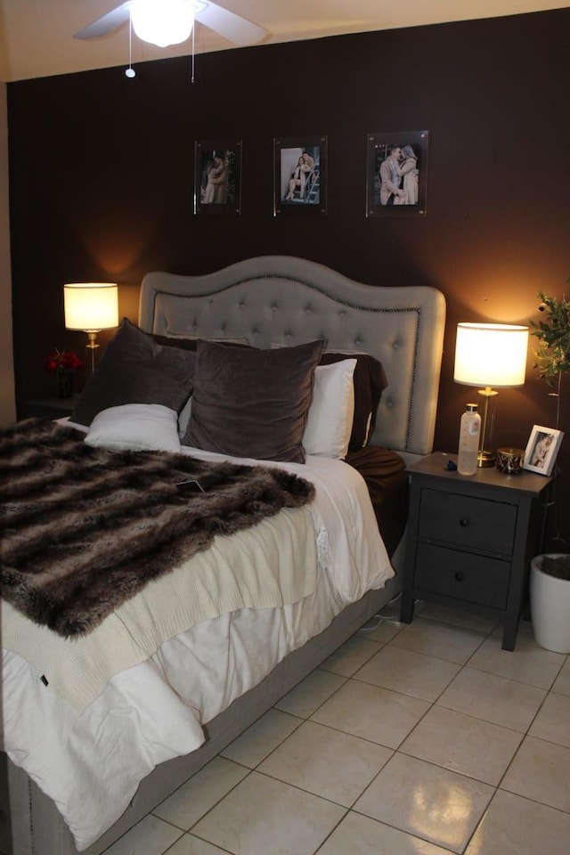 bedroom with light tile patterned floors and ceiling fan