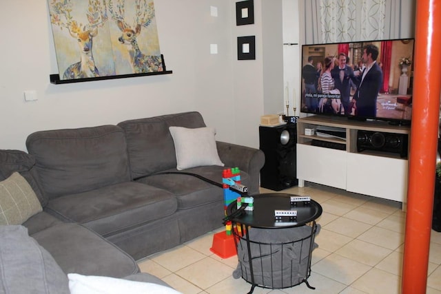 living area with tile patterned floors