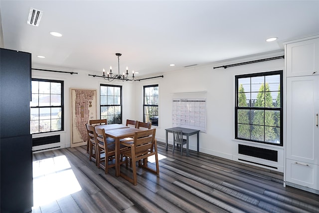 dining room with recessed lighting, baseboards, an inviting chandelier, and dark wood-style floors