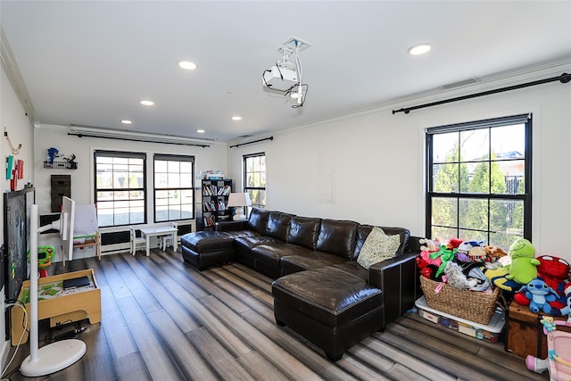 living area featuring visible vents, recessed lighting, ornamental molding, and wood finished floors