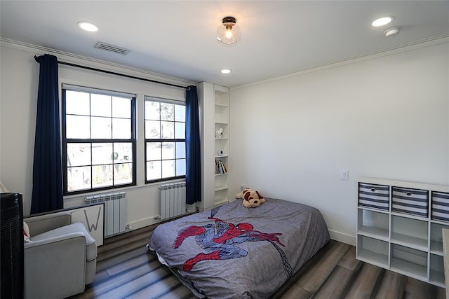 bedroom with recessed lighting, radiator heating unit, dark wood-style floors, and visible vents