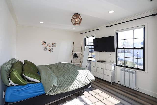 bedroom featuring radiator heating unit, dark wood-style floors, recessed lighting, and baseboards