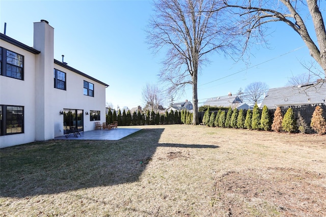 view of yard with fence and a patio area