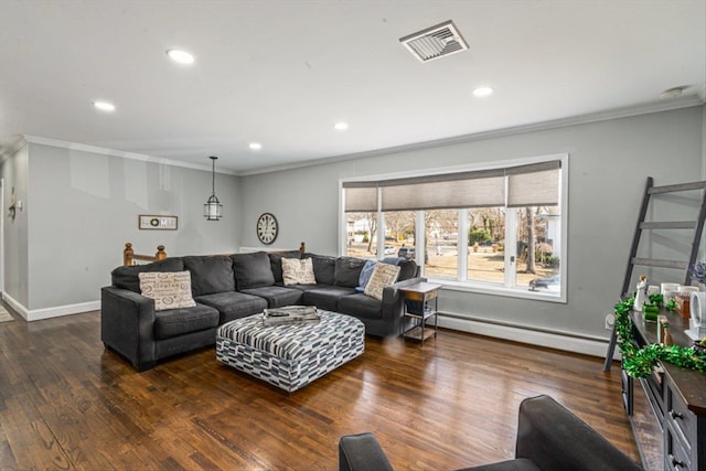 living room with a baseboard radiator, wood finished floors, visible vents, and crown molding