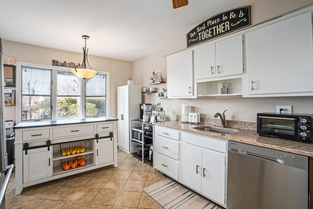 kitchen featuring a toaster, open shelves, white cabinetry, a sink, and dishwasher