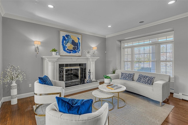 living room featuring ornamental molding, wood finished floors, a high end fireplace, and baseboards