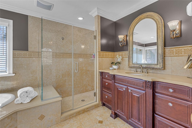 bathroom with a stall shower, crown molding, and tile walls