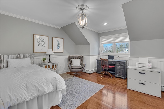 bedroom featuring a wainscoted wall, a baseboard radiator, hardwood / wood-style floors, crown molding, and a chandelier