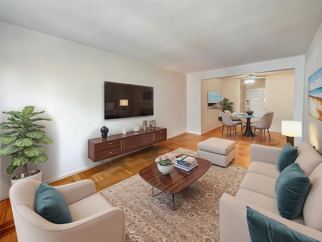 living room featuring baseboards