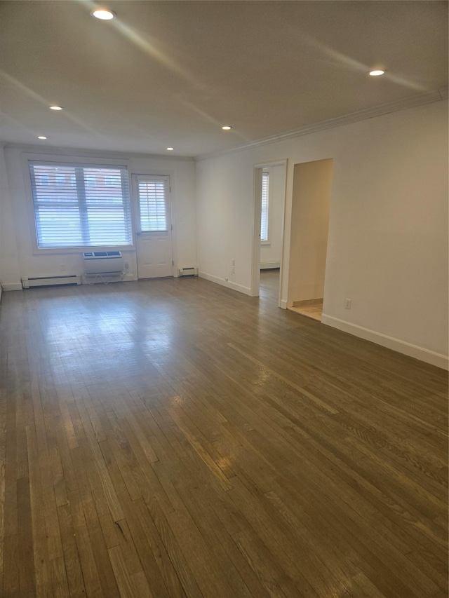 unfurnished room with a baseboard radiator, baseboards, dark wood-style flooring, and recessed lighting