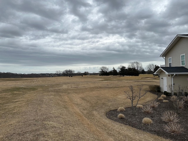 view of yard with a rural view