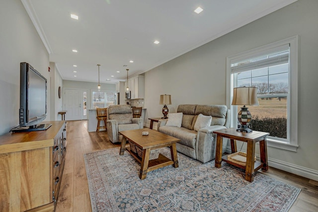 4109 Fox Hill Dr Unit 4109, Baiting Hollow, NY 11933 - living area featuring ornamental molding, recessed lighting, light wood-style flooring, and baseboards