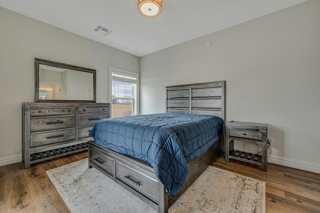 4109 Fox Hill Dr Unit 4109, Baiting Hollow, NY 11933 - bedroom featuring wood finished floors, visible vents, and baseboards