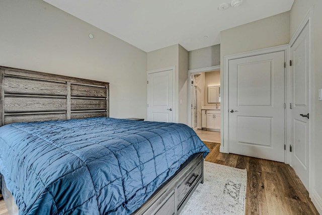 4109 Fox Hill Dr Unit 4109, Baiting Hollow, NY 11933 - bedroom featuring ensuite bath and wood finished floors