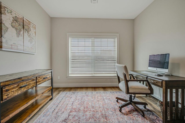 4109 Fox Hill Dr Unit 4109, Baiting Hollow, NY 11933 - home office featuring wood finished floors, visible vents, and baseboards