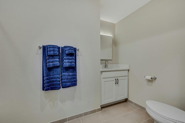 4109 Fox Hill Dr Unit 4109, Baiting Hollow, NY 11933 - half bathroom featuring toilet, vanity, baseboards, and tile patterned floors