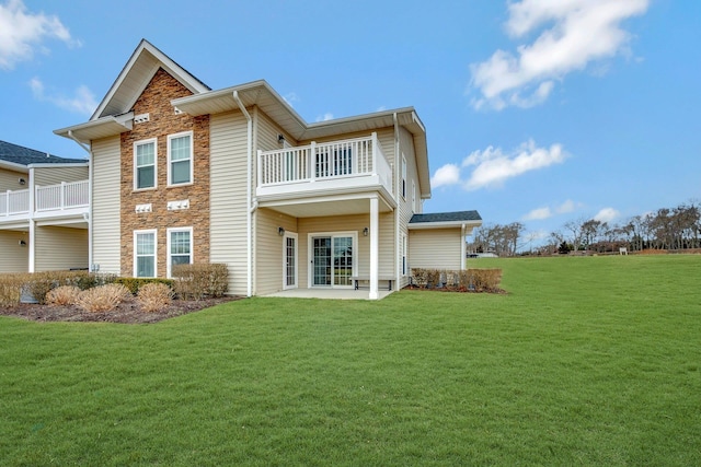 4109 Fox Hill Dr Unit 4109, Baiting Hollow, NY 11933 - rear view of house with a patio, a lawn, and a balcony