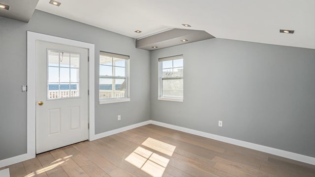 interior space featuring baseboards, wood finished floors, and recessed lighting