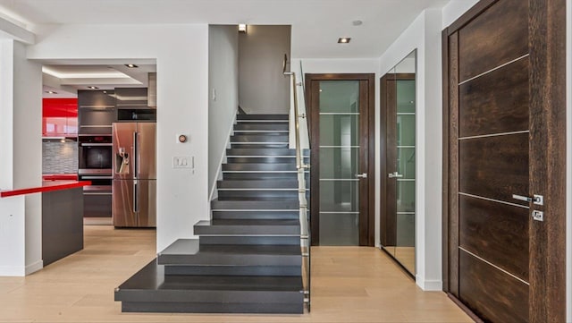 stairs with wood finished floors