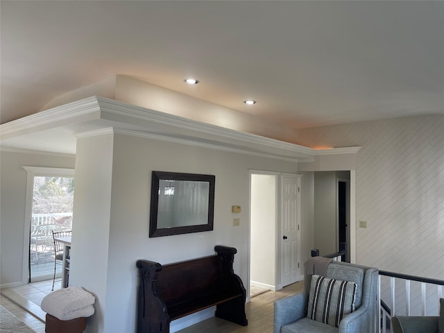 living room with light wood-style floors, baseboards, ornamental molding, and recessed lighting