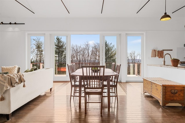 dining area with hardwood / wood-style flooring