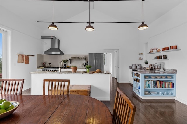 dining area with high vaulted ceiling, dark wood-type flooring, and baseboards