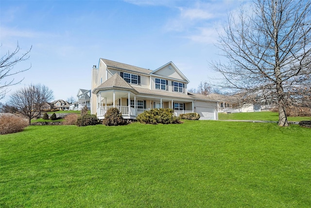 view of front of home with a porch, an attached garage, and a front yard